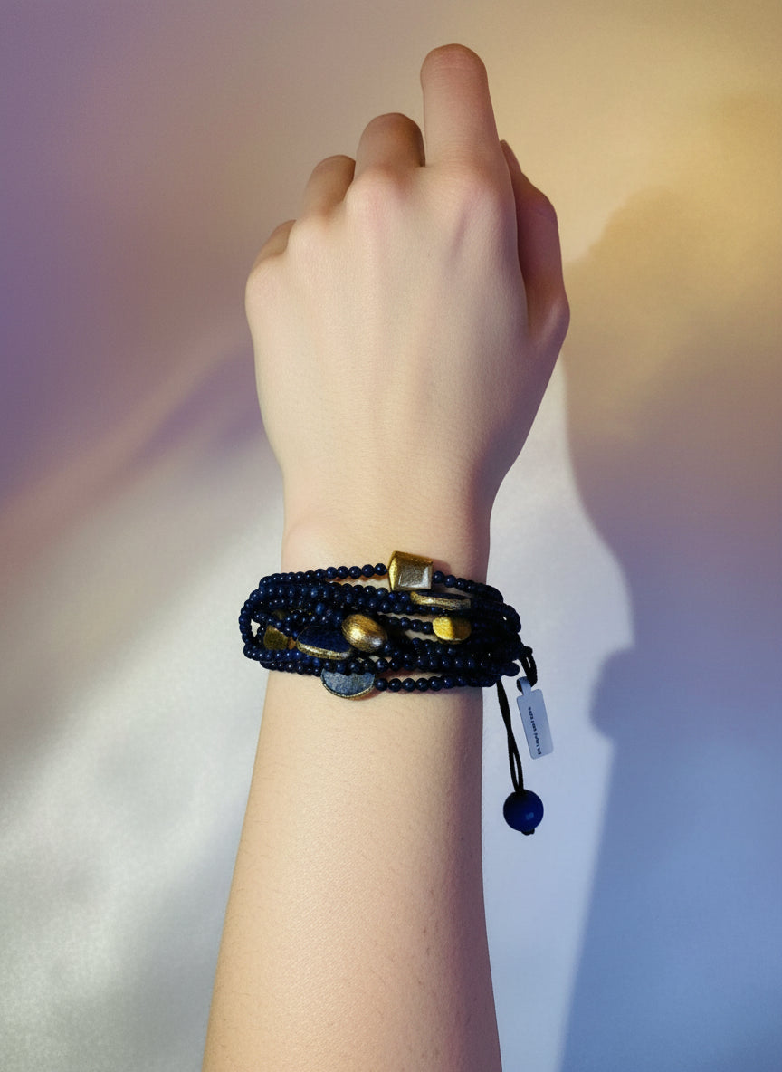 Beaded bracelet with blue beads and gold accents