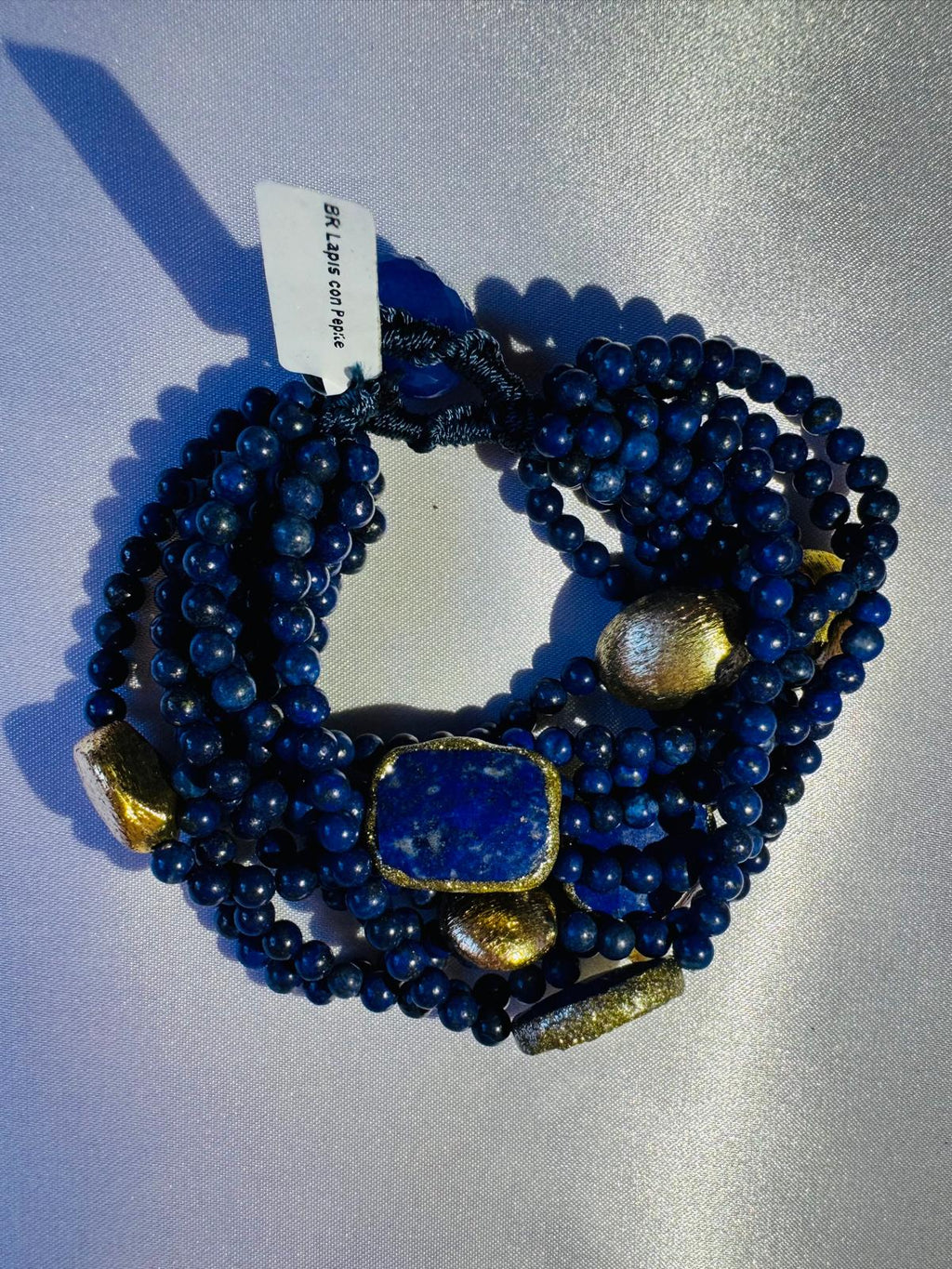 Multi strand Blue beaded bracelet with lapis lazuli and golden nuggets