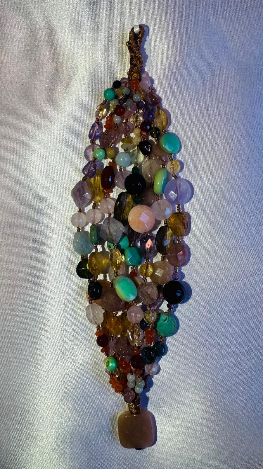 Multi strand bracelet with various hard stones.