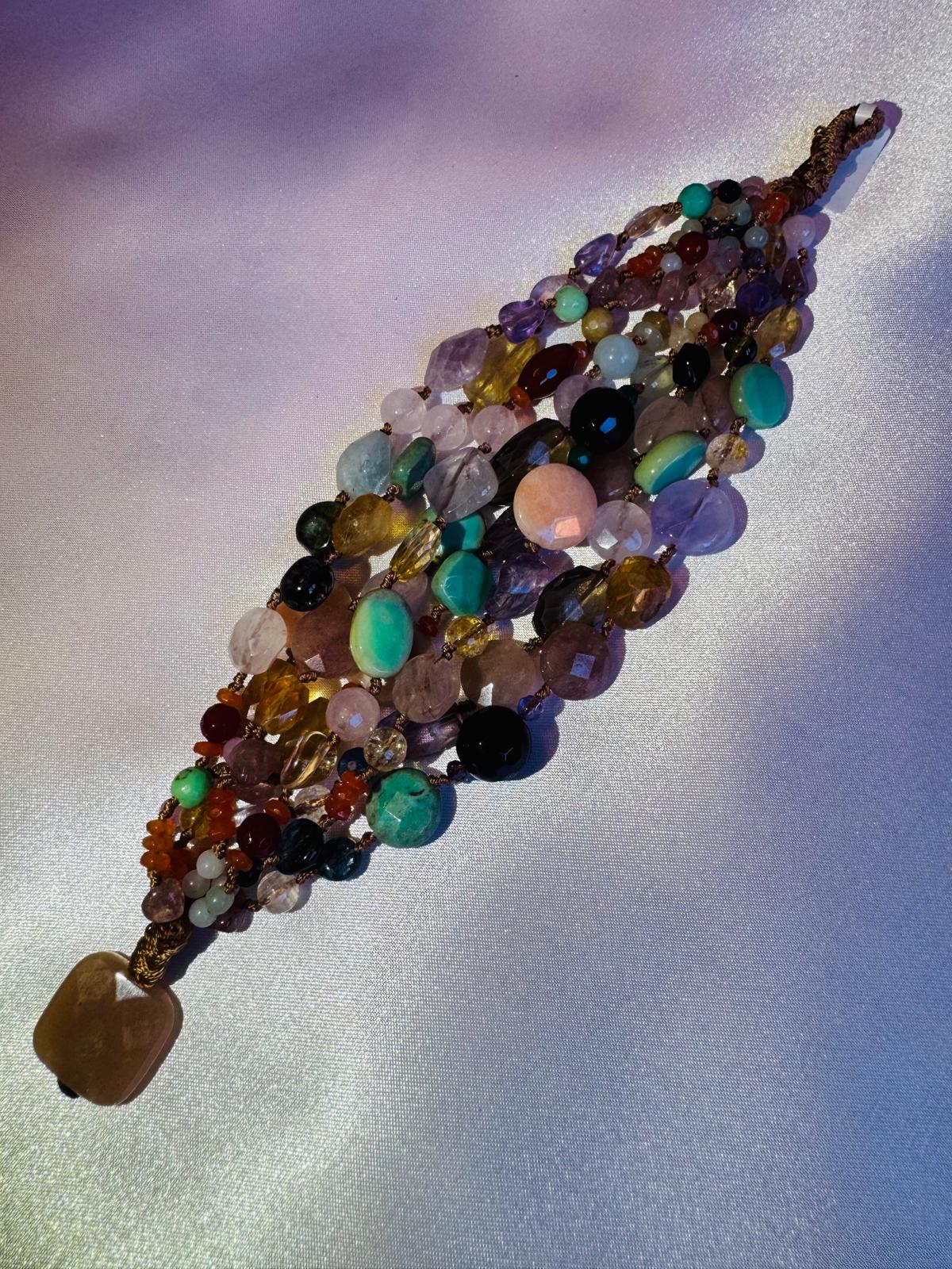 Multi strand bracelet with various hard stones.