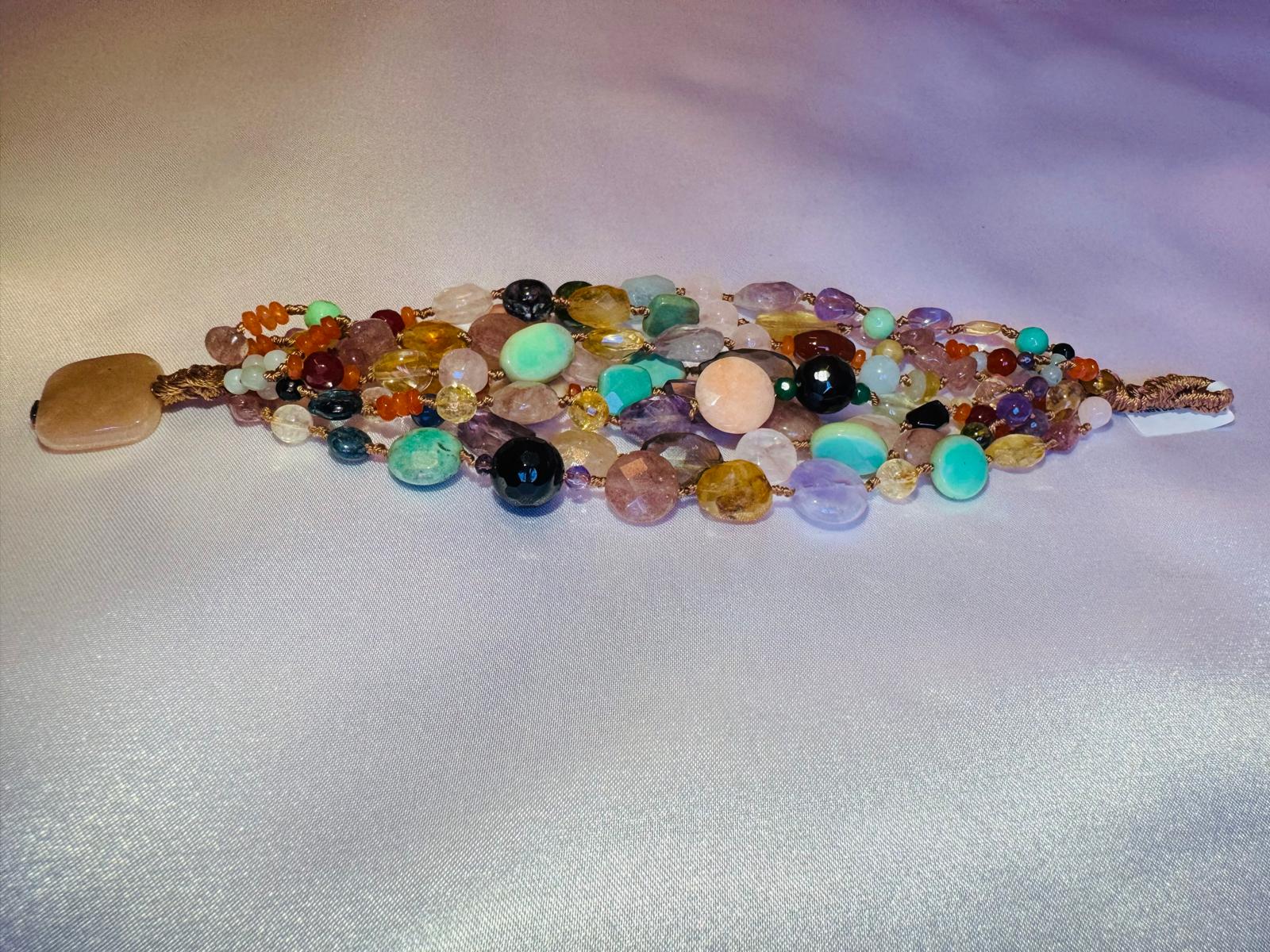 Multi strand bracelet with various hard stones.