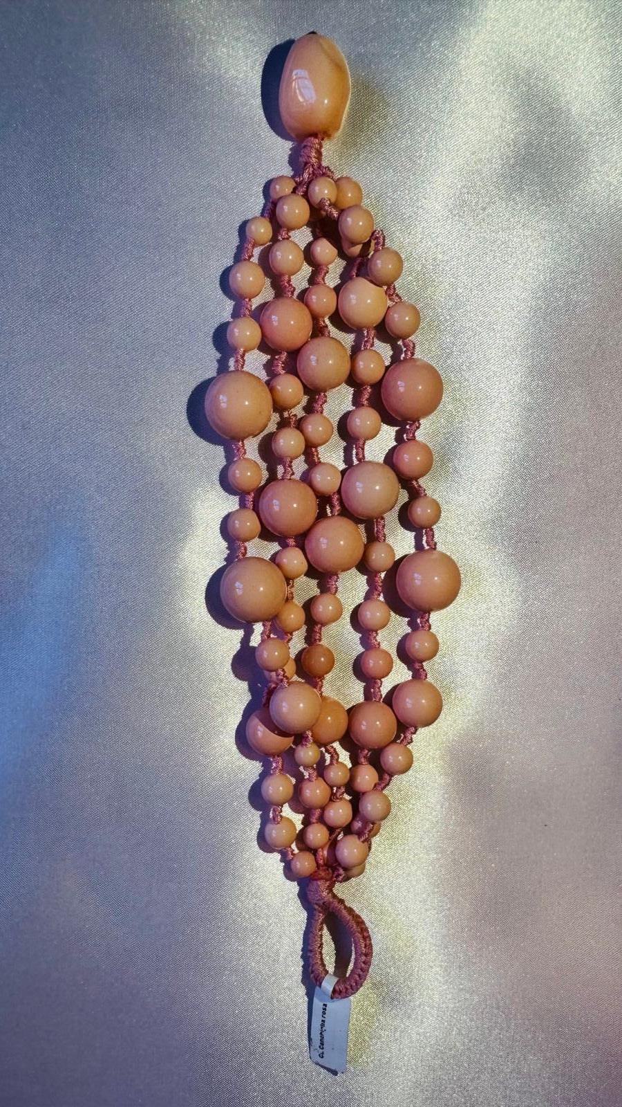 Multi strand bracelet with pink shell