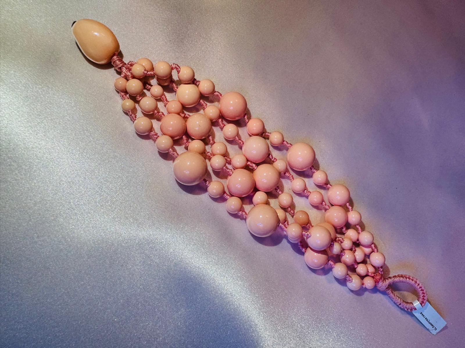 Multi strand bracelet with pink shell