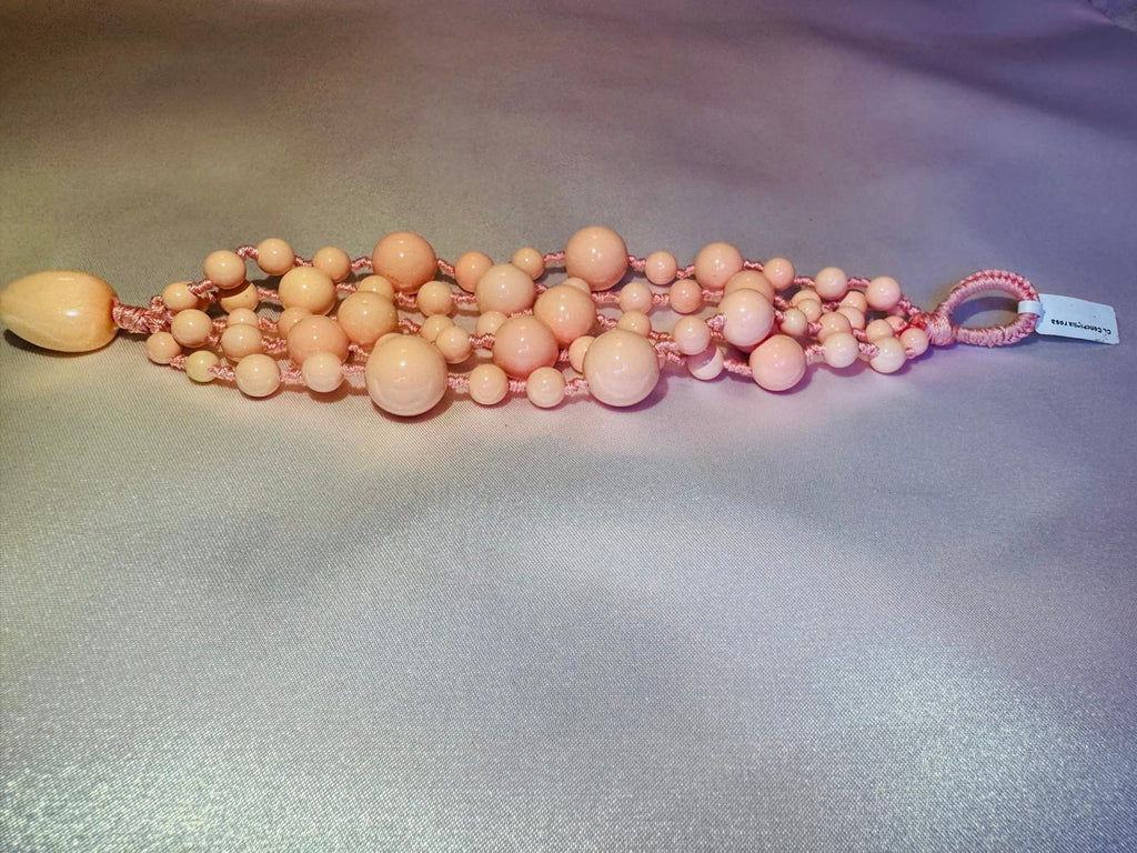 Multi strand bracelet with pink shell
