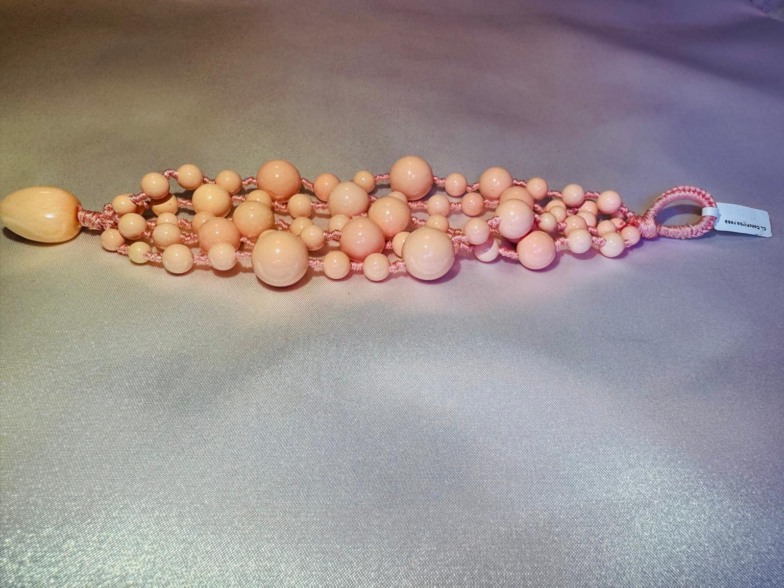 Multi strand bracelet with pink shell