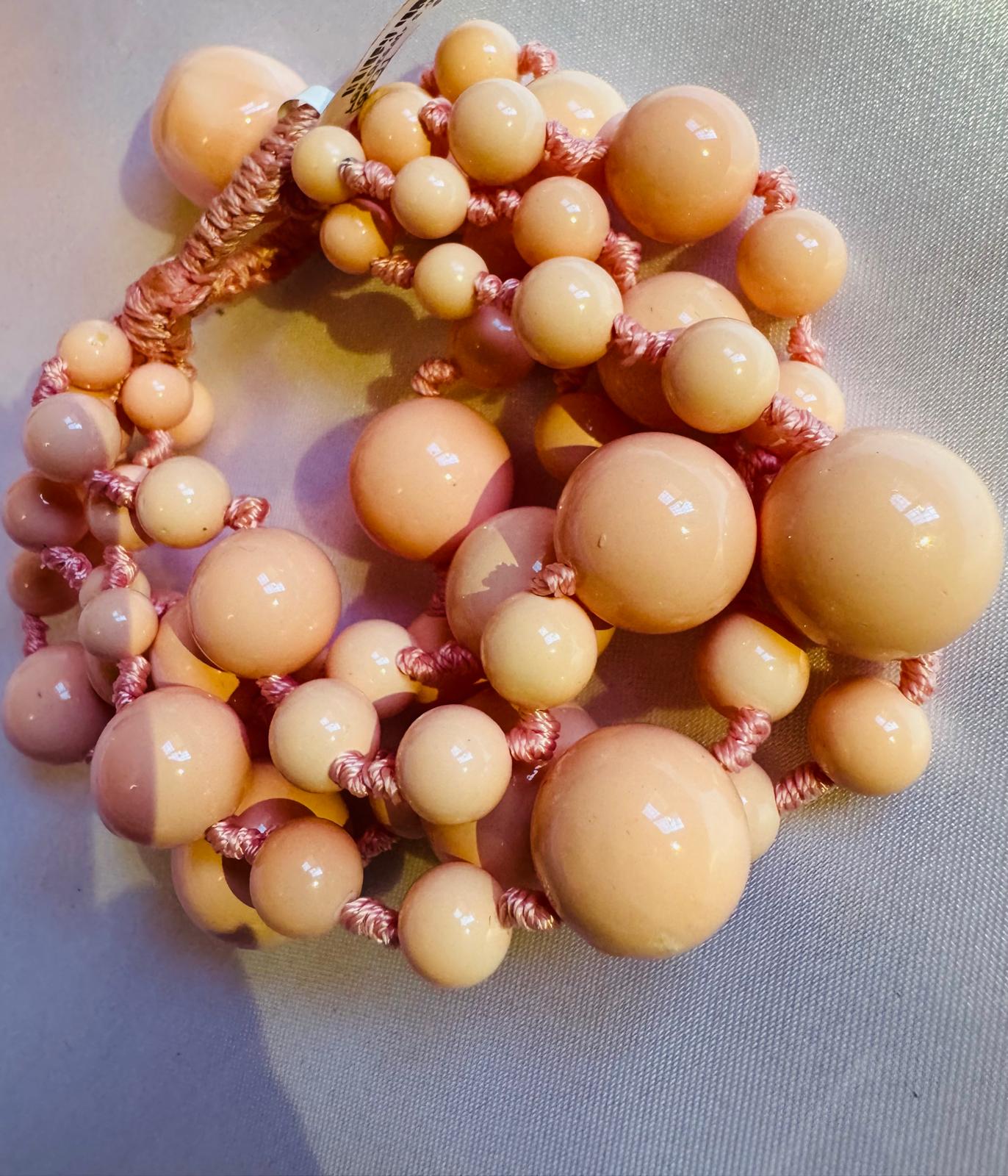 Multi strand bracelet with pink shell