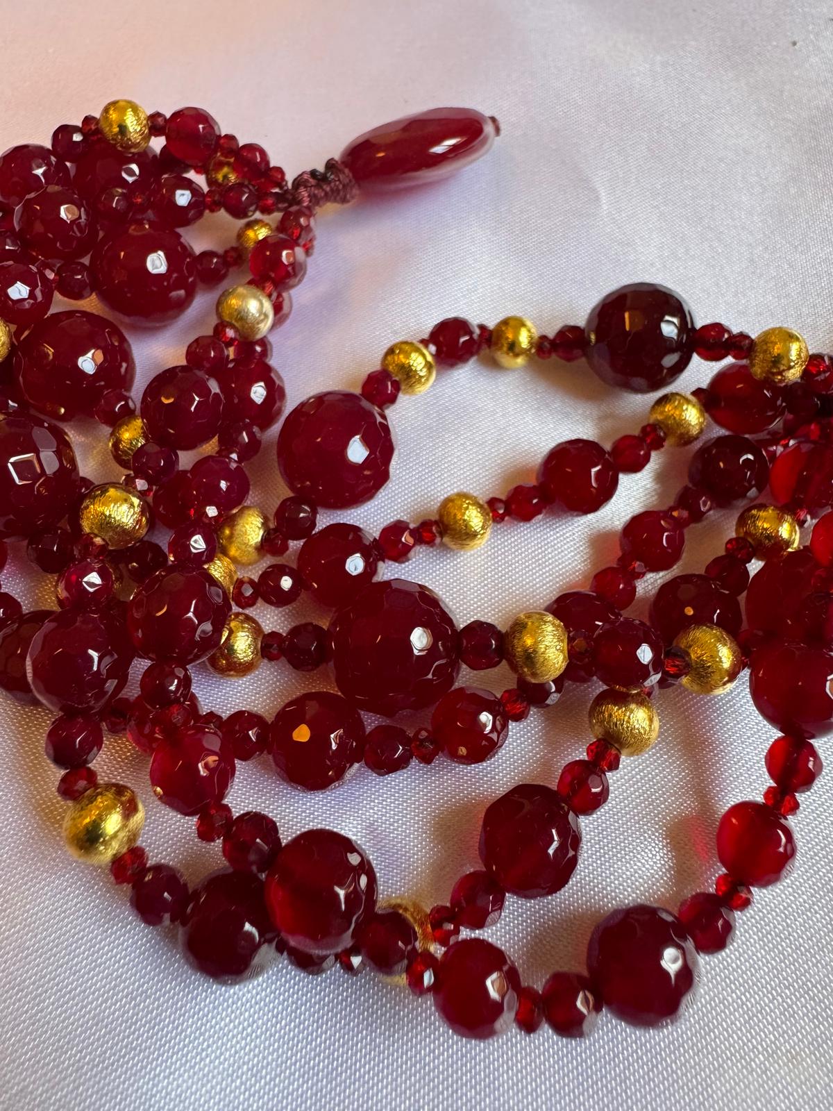Bracelet Multi strand with Red beaded spinel and golden nuggets.
