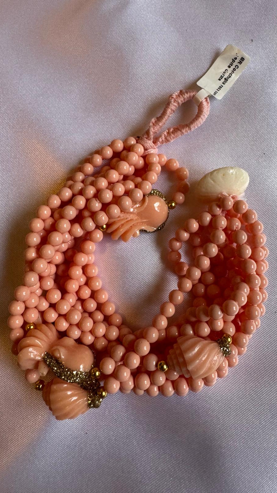 Pink beaded necklace with shell elements