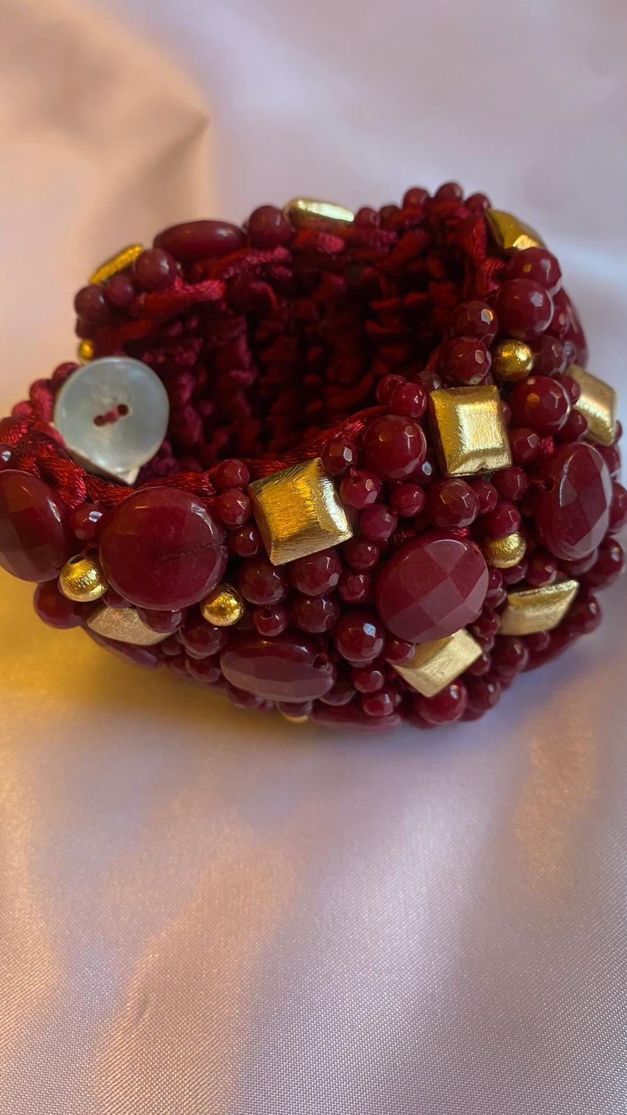 Dark Red Agate Bracelet with Golden nuggets and a Mother of Pearl clasp.