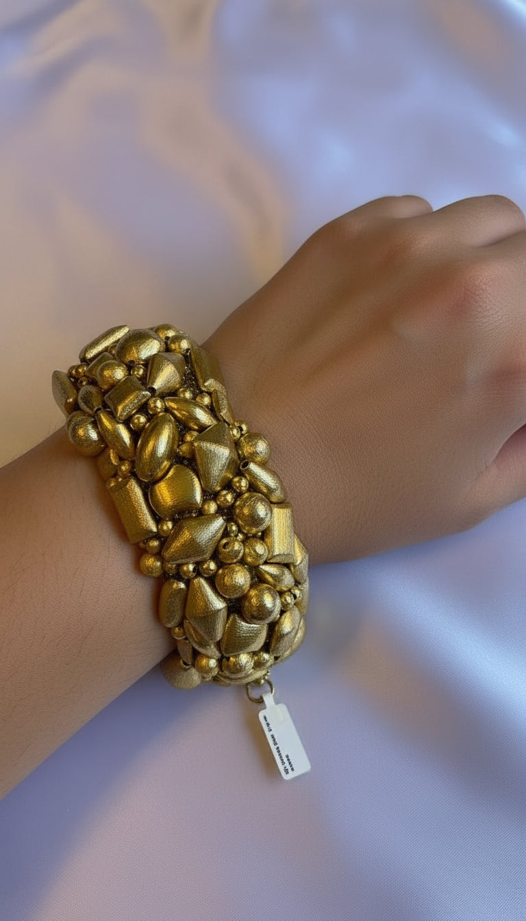 Golden nugget bracelet with mother of pearl clasp.