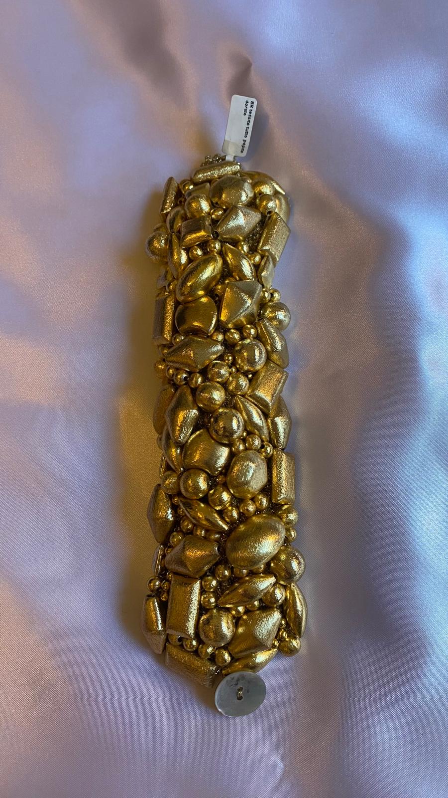 Golden nugget bracelet with mother of pearl clasp.