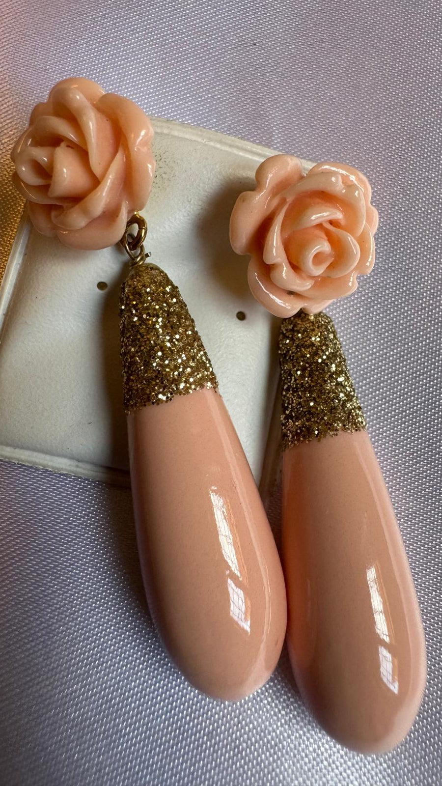 Pink shell and resin earrings with floral tops and glittery gold accents