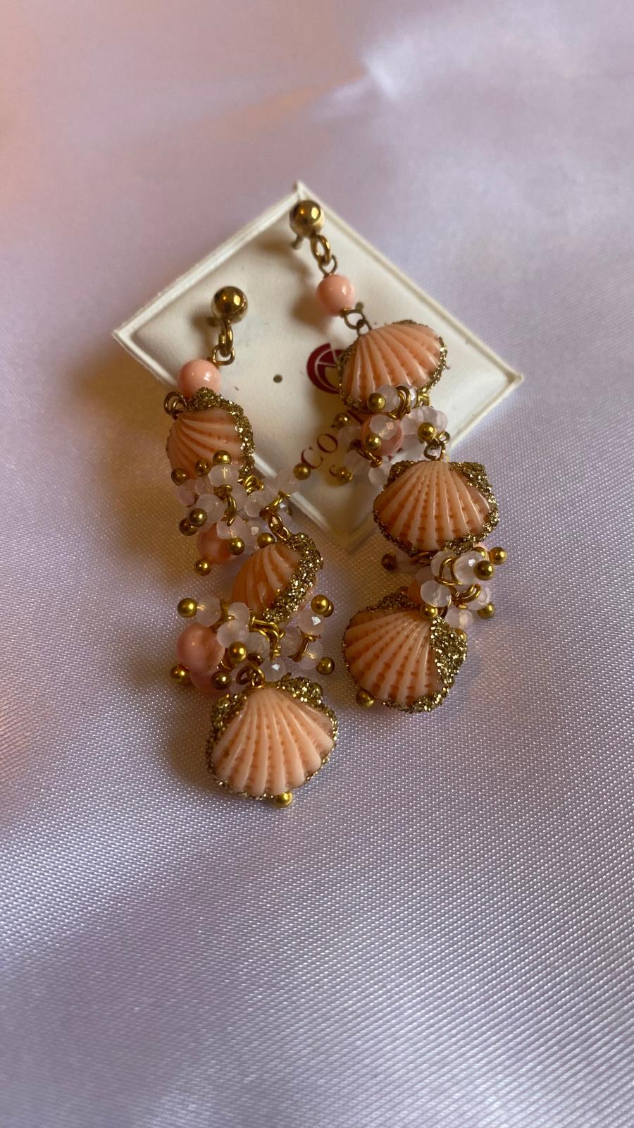 Pink shell, resin, and rose quartz earrings.