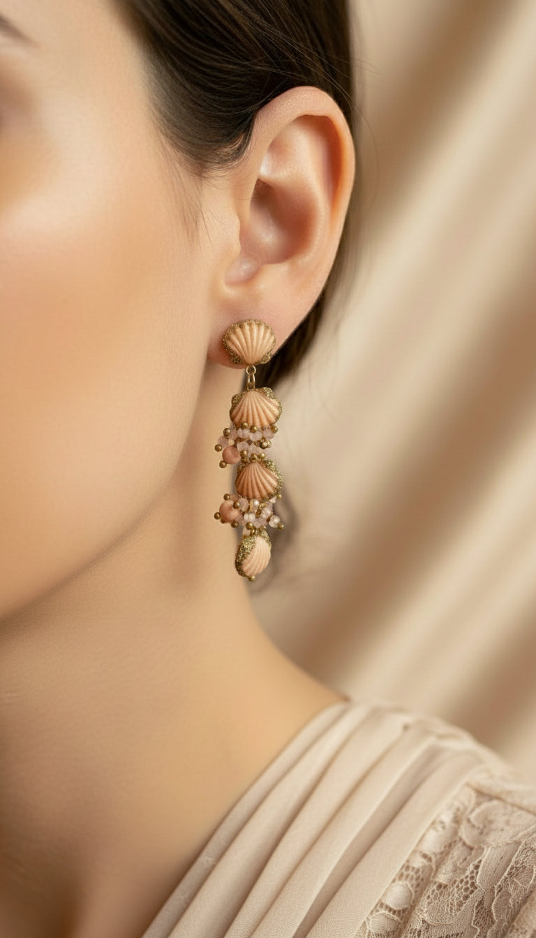 Shell-shaped earrings with gold accents