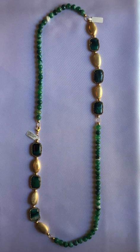 Necklace with stripped green Tourmaline beads and gold accents.