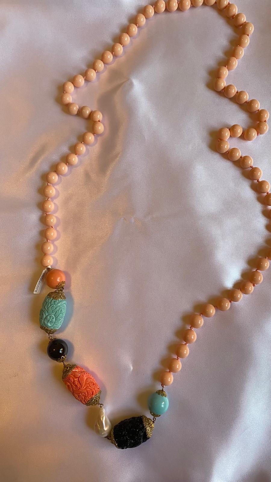 Necklace made of Pink Shell, Resin, Freshwater Pearls, and Onyx.