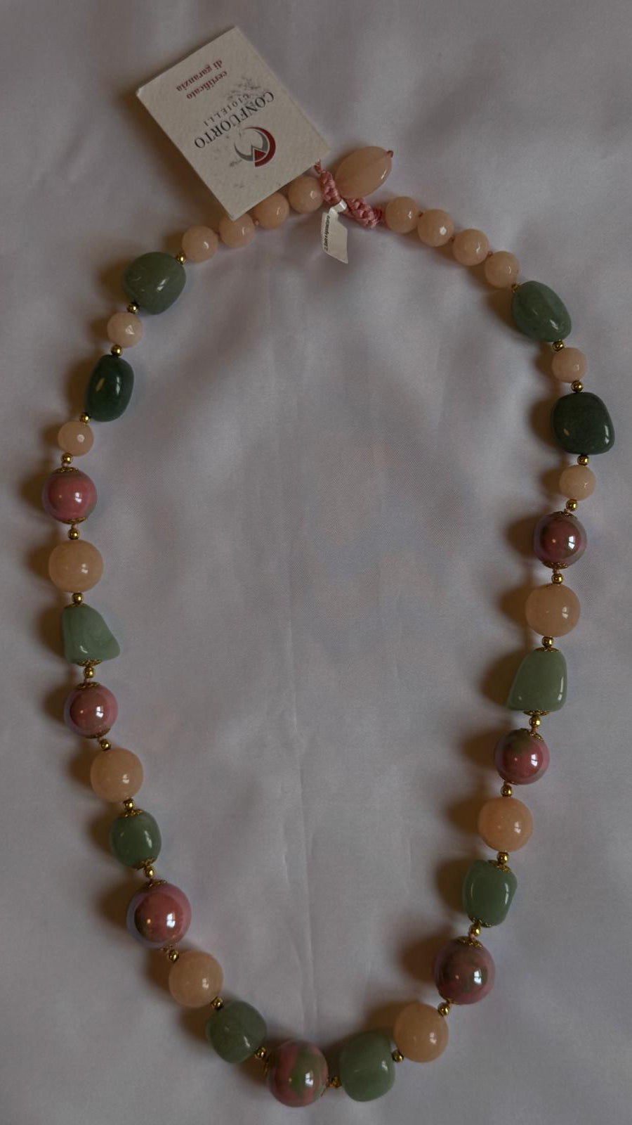 Necklace with multicolored beads on a white background